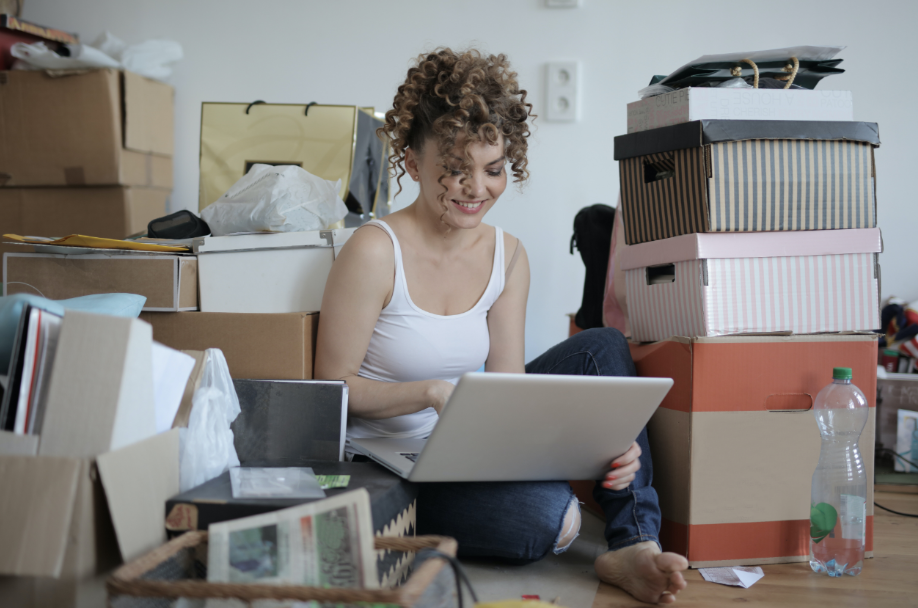 woman with laptop and packages